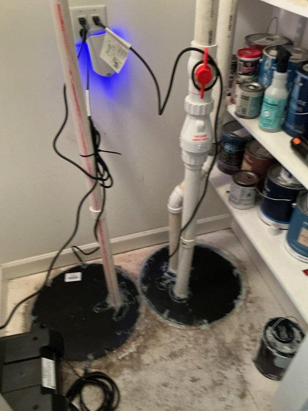 Responded to recurring basement ejector pump failure on fourth service visit for ongoing warranty issue in 24-year-old home. Upon arrival, discovered significant water damage to carpeted floor surrounding ejector pump installation, with standing water and saturation visible around PVC discharge piping. Inspected pump system, discharge plumbing, and electrical connections to diagnose persistent malfunction. Documented water intrusion damage and compromised flooring conditions with photographs for warranty claim processing. Evaluated pump performance, check valve operation, and float switch functionality to identify root cause of repeated failures.
