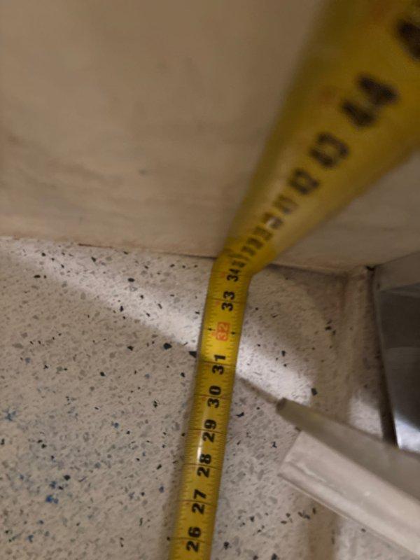 Responded to reported leak in Unit 2 and conducted initial assessment of shower stall plumbing system. Performed measurements and photographic documentation of affected areas, including ceiling junction and shower pan assembly with center drain. Inspection revealed potential water intrusion points requiring further evaluation of piping connections and waterproofing integrity.
