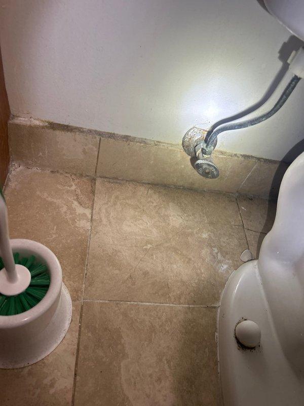 Replaced defective angle stop valve serving the toilet water supply line. Shut off main water supply, removed old angle stop, and installed new chrome angle stop valve to restore proper water flow control to the fixture. Tested for leaks and verified proper operation upon completion.
