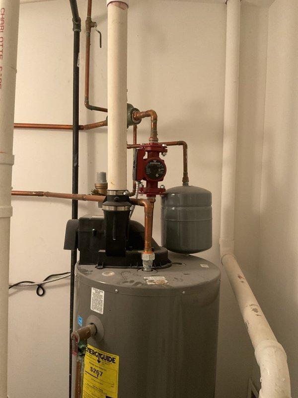 Completed comprehensive plumbing maintenance inspection on 8-year-old residential property. Performed thorough evaluation of water heater system, including tank condition, circulation pump operation, expansion tank mounting, and all associated copper and PVC piping connections. Verified proper function of backflow preventer, ball valves, and red-handled shutoff mechanisms. Inspected all visible plumbing components for leaks, corrosion, and proper installation standards. Documented system configuration with photographs showing water heater, circulation pump assembly, expansion tank, and complete piping layout for maintenance records. All systems found operating within normal parameters with no immediate concerns identified.