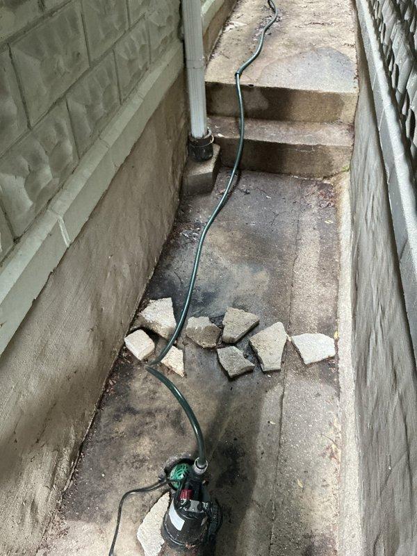 Conducted basement flood control assessment following recent water intrusion during heavy rainfall. Inspected existing drainage channel, sump pump system, and utility room conditions to evaluate flooding vulnerability. Provided estimate for installation of comprehensive flood prevention system to protect basement area from future water damage.
