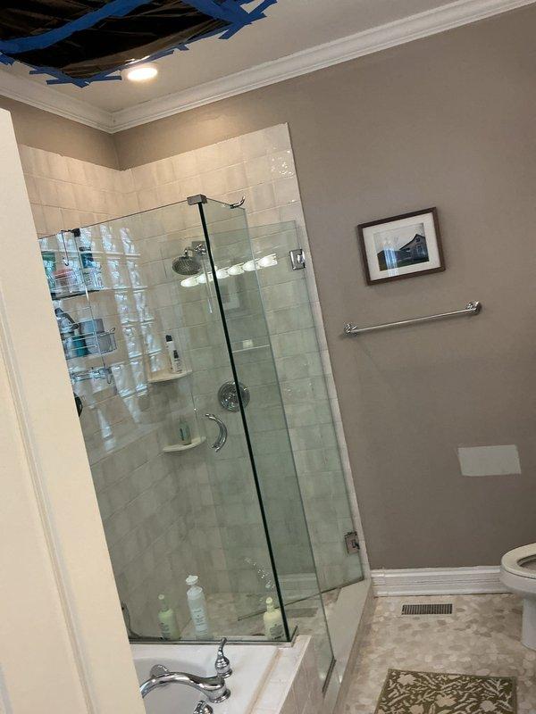 Returned to complete repair of broken pipe in bathroom ceiling following shower pan installation by another contractor. Accessed work area through existing ceiling opening, repaired damaged pipe section, and coordinated with ongoing bathroom renovation to finalize plumbing portion of project.