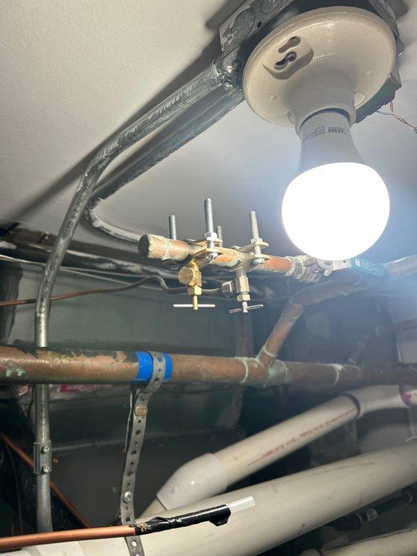 Performed comprehensive maintenance service on tankless water heater system, including complete drain and flush procedure to remove mineral buildup and sediment. Inspected all electrical connections, venting components with dual exhaust/intake pipes, copper supply lines, pressure relief valves, shut-off valves, and expansion tank for proper operation and safety compliance. Verified digital control panel functionality and confirmed all plumbing connections, mounting hardware, and system components were secure and operating within manufacturer specifications.