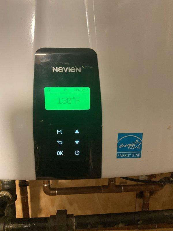 Performed routine maintenance and flushing service on two Navien tankless water heaters located in basement mechanical room. Both units were operating at elevated temperatures (130°F and 138°F) at time of service. Completed standard descaling flush procedure on both heaters to remove mineral buildup and sediment accumulation, ensuring optimal heat exchanger efficiency and prolonging equipment lifespan. Verified proper operation of digital control panels, confirmed temperature settings, and inspected copper supply lines and connections for leaks or corrosion. All components functioning within normal parameters following maintenance completion.