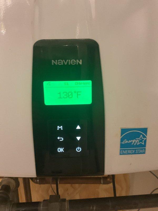 Performed routine maintenance and flushing service on two Navien tankless water heaters located in basement mechanical room. Both units were operating at elevated temperatures (130°F and 138°F) at time of service. Completed standard descaling flush procedure on both heaters to remove mineral buildup and sediment accumulation, ensuring optimal heat exchanger efficiency and prolonging equipment lifespan. Verified proper operation of digital control panels, confirmed temperature settings, and inspected copper supply lines and connections for leaks or corrosion. All components functioning within normal parameters following maintenance completion.
