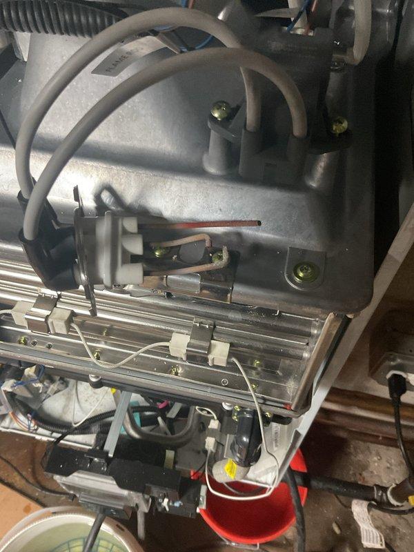 Responded to priority service call for tankless water heater system failure with error code indication and reported water leak. Inspected both Navien tankless units previously installed at property and diagnosed malfunctioning heat exchanger and burner assembly on primary unit. Performed complete system diagnostics, identified leak source at heat exchanger connections, and completed necessary repairs to restore hot water service. Unit tested and verified operational with proper venting and combustion parameters.