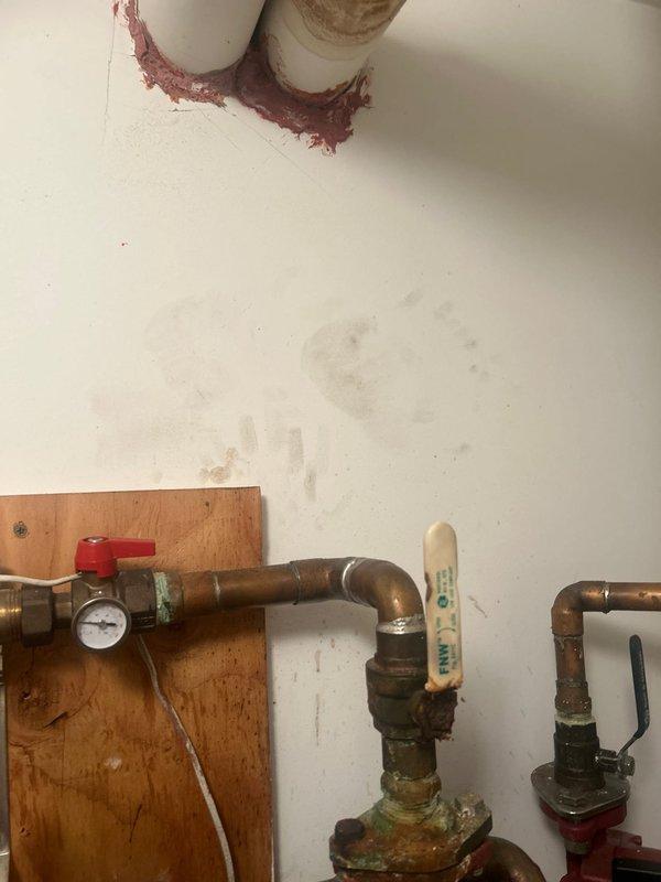 Responded to service call to diagnose issues with Grundfos circulator pump valve connected to radiant floor heating system and Kohler smart valve. Upon inspection, examined the red Grundfos circulator pump assembly mounted in mechanical room, including associated copper piping, ball valves, pressure gauges, and zone control components. Evaluated pump operation, electrical connections, and integration with radiant heating system. Assessed copper piping configuration, valve functionality, and system pressure readings. Inspected Kohler smart valve installation and performed diagnostic testing to identify operational concerns. Documented existing conditions of heating circulation system components including visible oxidation on copper fittings and overall system configuration for estimate preparation.