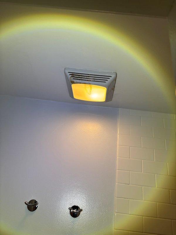 Installed bathroom exhaust fan and light fixture combination unit in residential bathroom. Verified proper ventilation operation and secured ASTM-rated plastic supply line in attic space with appropriate mounting hardware to structural framing members.