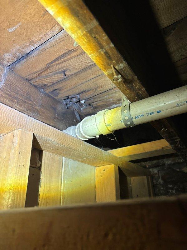 Installed bathroom exhaust fan and light fixture combination unit in residential bathroom. Verified proper ventilation operation and secured ASTM-rated plastic supply line in attic space with appropriate mounting hardware to structural framing members.