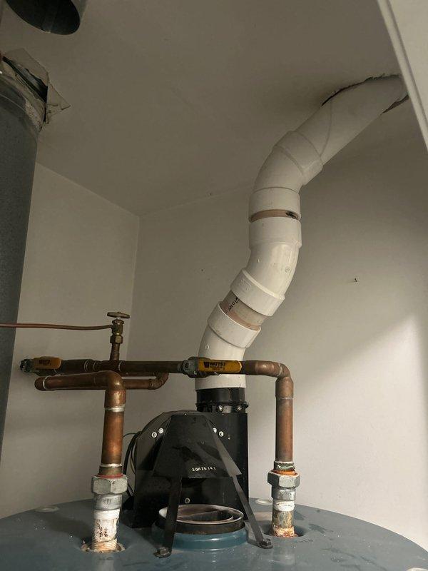 Conducted on-site evaluation for water heater replacement in residential mechanical room. Assessed existing Rheem PowerVent water heater system with circulation pump, copper piping connections, and PVC venting configuration. Documented current installation including electrical components, plumbing connections, and proximity to existing Lennox furnace unit. Provided comprehensive estimate for tank-style water heater replacement including necessary materials and labor.