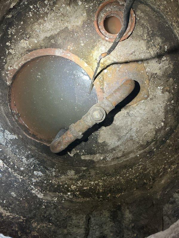 Responded to a commercial plumbing backup in the basement and conducted a thorough inspection of the main sewer line system. Upon investigation, identified severe deterioration and sediment buildup in the catch basin, with heavily corroded piping and extensive mineral deposits throughout the drainage system. Documented conditions with photographic evidence showing compromised infrastructure requiring main line repair to restore proper drainage function.