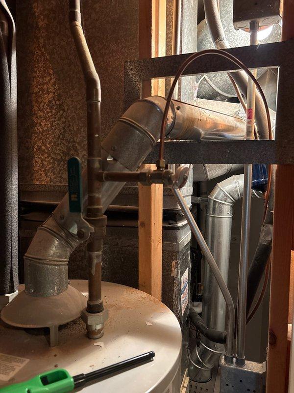 Responded to no hot water complaint following recent plumbing work for washer/dryer installation. Upon arrival, confirmed no hot water at any fixtures throughout the home. Investigated gas supply to tanked water heater and discovered gas shut-off valve remained in closed position from previous service visit. Reopened gas supply valve, verified proper gas flow to unit, and relit pilot light on water heater. Inspected burner assembly for proper ignition and flame pattern. Confirmed thermostat settings were appropriate and tested temperature-pressure relief valve for proper operation. Monitored unit through complete heating cycle to ensure consistent burner operation. Verified hot water delivery restored to all fixtures. Educated homeowner on location of gas shut-off valve and proper pilot light operation for future reference.