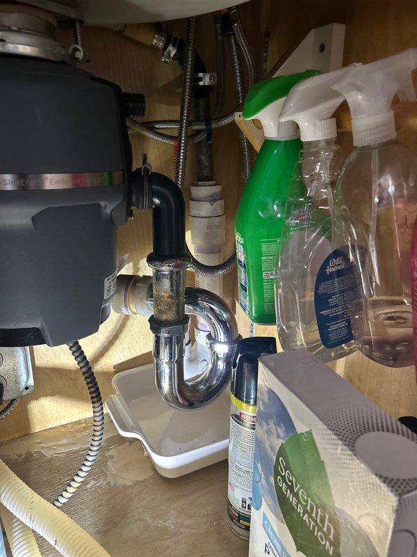 Responded to service call for non-functioning garbage disposal unit beneath kitchen sink. Upon inspection, found existing disposal unit inoperable and requiring replacement. Successfully removed failed disposal unit and installed new garbage disposal, ensuring proper electrical connections and secure mounting to sink drain assembly. Verified all plumbing connections including P-trap alignment and tested unit for proper operation and drainage. Also assessed kitchen sink faucet and under-sink water filtration system per customer request for future replacement consideration.