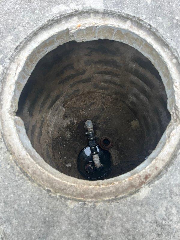 Performed preventative maintenance inspection on flood control sump pump system. Removed concrete access cover to gain entry to below-grade pump chamber and conducted thorough visual assessment of pump assembly and housing condition. Verified pump positioning, mounting integrity, and mechanical components for proper operation and potential wear indicators to prevent future flooding incidents.