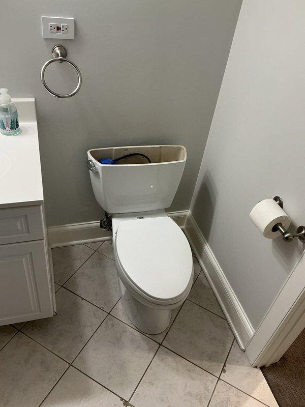 Responded to clogged drain service call at residential property. Technician and helper arrived for morning appointment with floor protection as requested. Successfully cleared drainage obstruction in bathroom and laundry area, restoring proper water flow. Documented work site conditions with photographic evidence showing bathroom fixtures, tile flooring, and laundry appliances in affected areas.