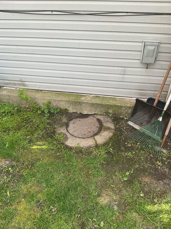 Performed camera inspection to diagnose recurring toilet clogs and slow drainage issues that developed following a basement flooding incident. Video inspection revealed underground drainage system accessing main sewer line through exterior cleanout pit, with brick-lined access shaft showing significant deterioration and debris accumulation at the base that may be contributing to drainage restrictions.