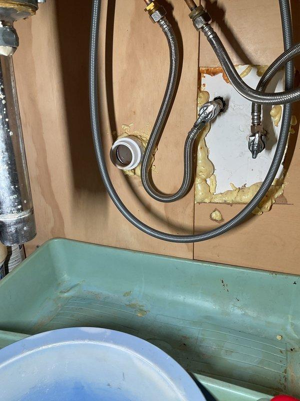 # Clogged Kitchen Sink Drain - Third Floor

Responded to a clogged kitchen sink drain line on the third floor. Deployed a 100-foot power rodding machine to mechanically clear the blockage in the kitchen sink drain line. Accessed the drain system through the cabinet beneath the sink and fed the rodding cable through the line to break up and remove the obstruction.

The power rodding equipment was positioned on protective matting in front of the sink cabinet to prevent floor damage during operation. The rodding process involved feeding the flexible cable with cutting head through the drain line to physically break apart accumulated debris and restore drainage flow.

Upon completion of the rodding service, tested the drain line for proper flow. Customer was advised that rodding service carries no warranty due to the nature of the work and potential for recurring blockages depending on underlying drain line conditions or usage patterns. Customer was informed that if full flow could not be 