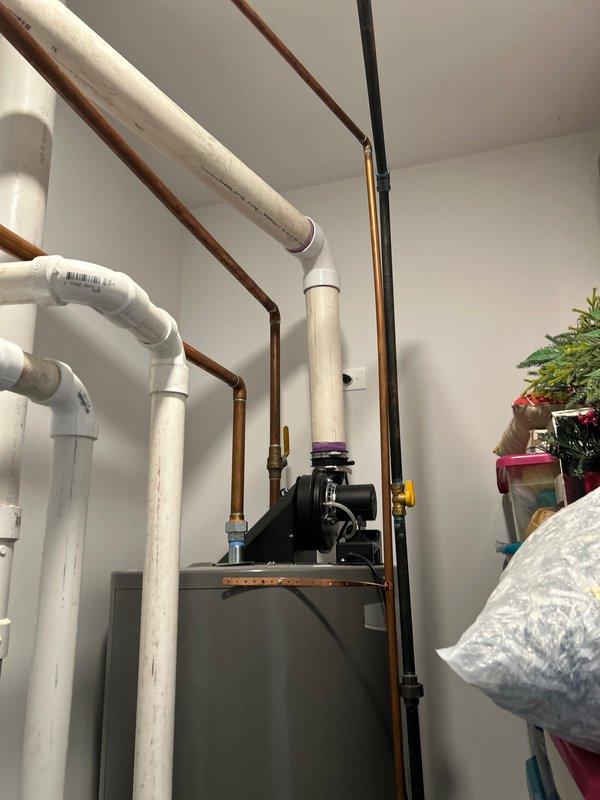 Installed new kitchen faucet with pull-down sprayer featuring contemporary chrome finish and single-lever handle operation. Completed installation with proper water supply connections and verified full functionality of the faucet assembly and spray mechanism.