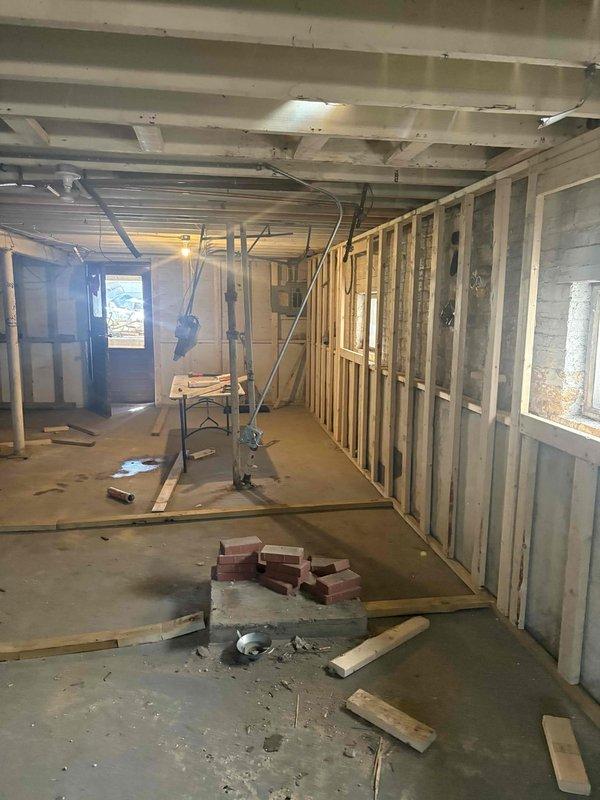Provided comprehensive plumbing estimate for miscellaneous piping work in an active residential construction site featuring exposed framing and subflooring. Assessed the space to determine piping requirements for the basement or lower level area currently in the rough-in construction phase, documenting existing conditions through photographs for accurate scope development and material planning.