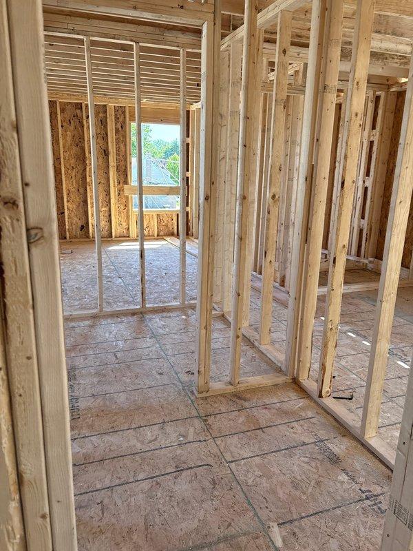 Provided comprehensive plumbing estimate for miscellaneous piping work in an active residential construction site featuring exposed framing and subflooring. Assessed the space to determine piping requirements for the basement or lower level area currently in the rough-in construction phase, documenting existing conditions through photographs for accurate scope development and material planning.