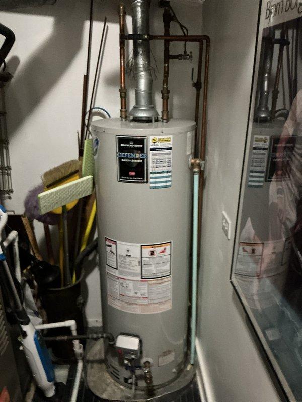 Completed annual maintenance flush on tank-style water heater located on second floor of 50-year-old condo building. Drained sediment from tank, inspected anode rod and all connections, verified proper operation of temperature and pressure relief valve, and tested heating elements for optimal performance. Unit operating within normal parameters with no leaks detected.