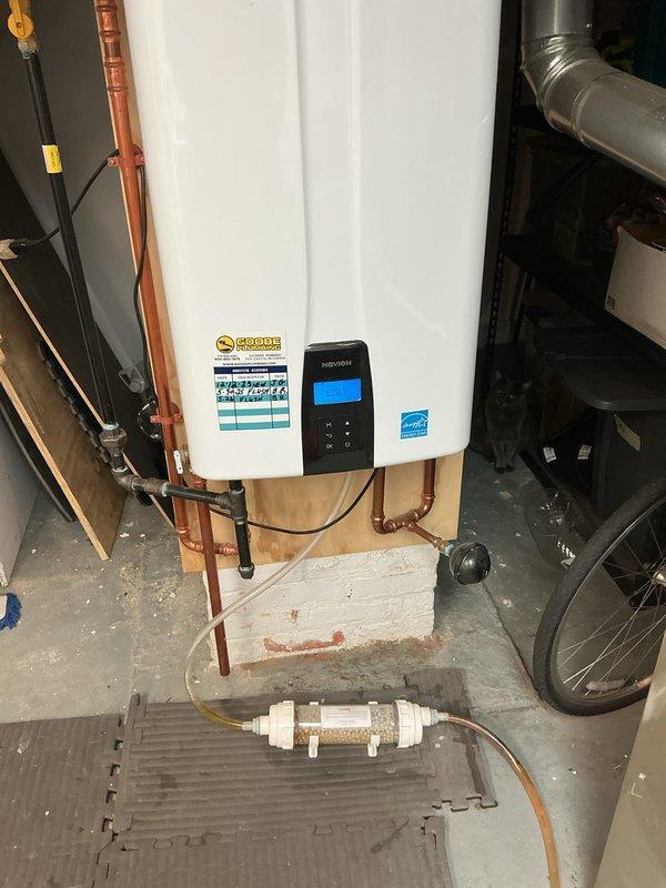 Completed VIP priority plumbing maintenance inspection of residential water systems. Performed comprehensive evaluation of tankless water heater installation, verifying proper operation of all copper supply and return lines, digital control interface functionality, and mounting stability. Inspected sump pit condition, noting water level and float assembly operation within acceptable parameters for continued service.