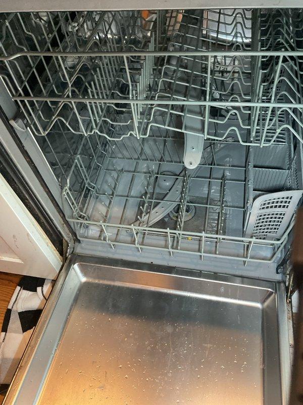 Responded to service call for dishwasher overflowing issue. Upon inspection, found standing water with debris in the dishwasher basin, indicating a drainage obstruction. Accessed the drain line from the crawl space above and cleared the clog in the dishwasher discharge pipe. Verified proper drainage and confirmed the appliance was functioning correctly with no further overflow issues.
