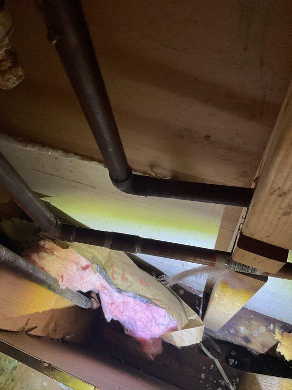 Responded to service call for dishwasher overflowing issue. Upon inspection, found standing water with debris in the dishwasher basin, indicating a drainage obstruction. Accessed the drain line from the crawl space above and cleared the clog in the dishwasher discharge pipe. Verified proper drainage and confirmed the appliance was functioning correctly with no further overflow issues.