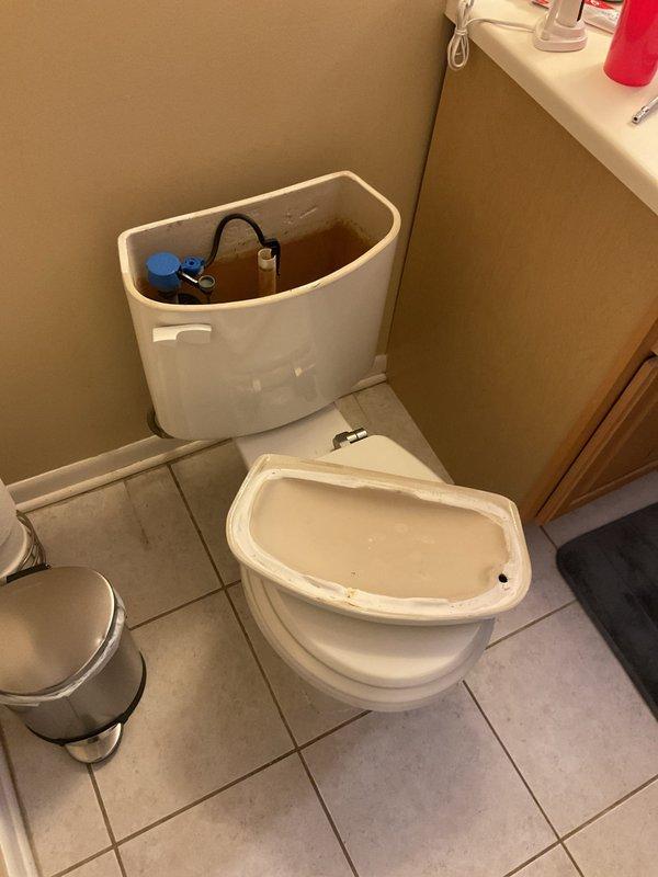 Responded to service call for toilet instability caused by broken closet bolt at base. Inspected second toilet and identified improper installation with excessive wax ring stacking (three rings) due to misalignment between fixture and waste pipe. Documented conditions of both fixtures with photographs showing compromised floor flange hardware and deteriorated hex tile flooring around toilet base. Provided estimate for proper reinstallation with flange repair and correct wax ring application.