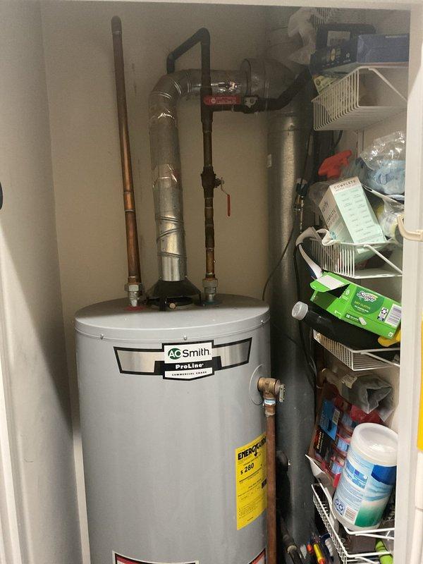 Successfully installed a 40-gallon A.O. Smith ProLine atmospheric water heater in a third-floor utility closet, including draining and removing the existing unit from the property. Retrofitted all necessary connections utilizing existing 3/4" copper water supply lines and 1/2" black iron gas piping, reused the existing drain pan, and installed pressure relief valve with proper discharge piping. All connections were tested and verified operational with no leaks detected.