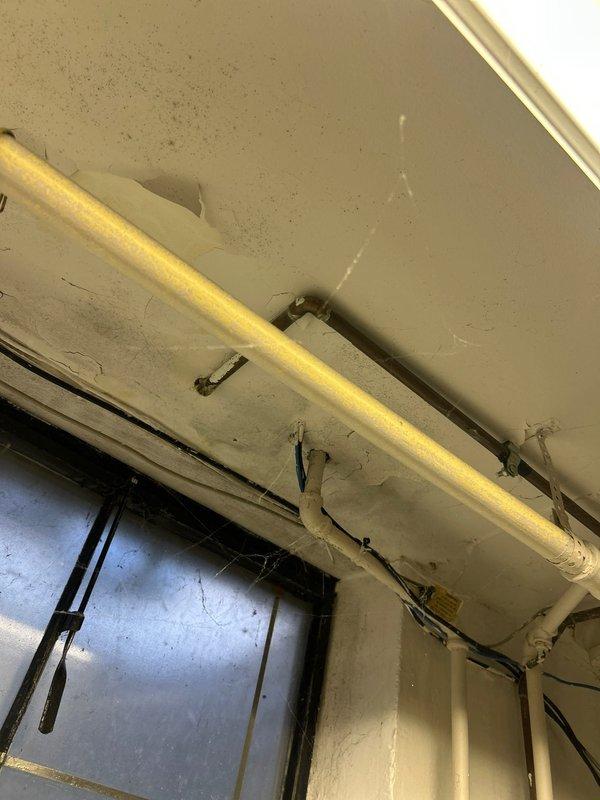 Responded to emergency plumbing call involving flooding from outdoor spigot that caused water damage to kitchen and basement. Inspected and repaired copper supply line connections and brass fittings at spigot penetration point through exterior wall. Addressed multiple fixture issues in downstairs bathroom including restoration of hot water supply to shower and repair of non-functioning cold water valve at bathroom faucet. Verified proper operation of all affected fixtures and confirmed no active leaks at repaired connections.