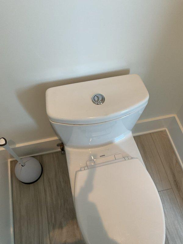Investigated second-floor bathroom plumbing issues including faucet malfunction, clogged sink drain, and unusual noise during toilet flushing. Inspected P-trap assembly and drain system beneath bathroom sink, examining chrome fixtures and drainage components for blockages or mechanical failures. Assessed TOTO dual-flush toilet operation and internal tank mechanisms to diagnose source of abnormal flushing sounds, preparing recommendations for toilet rebuild and necessary repairs to restore proper functionality.