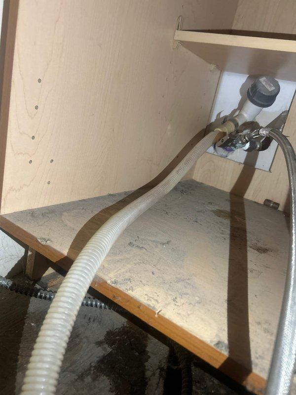 Completed plumbing estimate for dishwasher valve repair and replacement under kitchen sink cabinet. Assessed existing water supply connections, flexible braided supply lines, and shutoff valve condition showing signs of age and potential leakage. Provided estimate for valve replacement to restore proper water supply control to dishwasher.