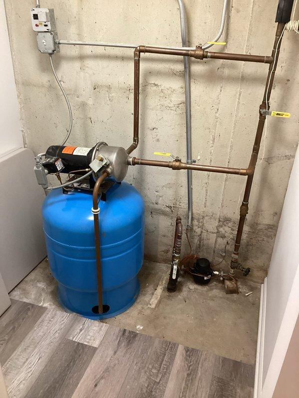 Completed installation of a standard two-piece white porcelain toilet with chrome flush lever and round bowl design. The unit was successfully installed, tested for proper flushing operation, and verified for secure mounting and leak-free connections at all supply and drain points.