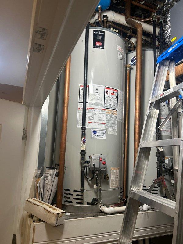 Responded to service call for no hot water condition affecting two water heaters in residential property. Upon arrival, inspected utility closet containing gas-fired water heater installation with associated plumbing connections, copper supply lines, and blue-handled shutoff valve. Documented equipment condition and surrounding mechanical systems including HVAC components and visible piping infrastructure. Performed diagnostic assessment of water heating system to identify cause of failure and provide estimate for necessary repairs or replacement.
