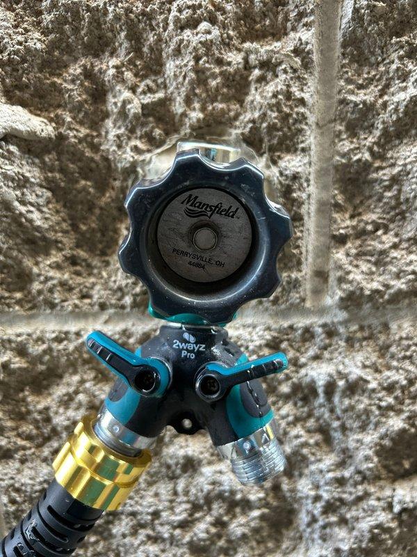 Responded to call for leaking outdoor spigots that were discovered upon seasonal activation after winter. Inspected existing plumbing fixtures and determined replacement was necessary due to freeze damage. Installed new outdoor spigot assemblies featuring Mansfield frost-free sillcocks with 2-way ball valve distribution systems, allowing for multi-purpose water access. Mounted fixtures to exterior wall with proper sealing and weatherproofing to prevent future water intrusion. Configured valve system to provide independent control for standard hose connection and auxiliary water outlet. Tested all connections under full pressure to verify leak-free operation and proper valve functionality.
