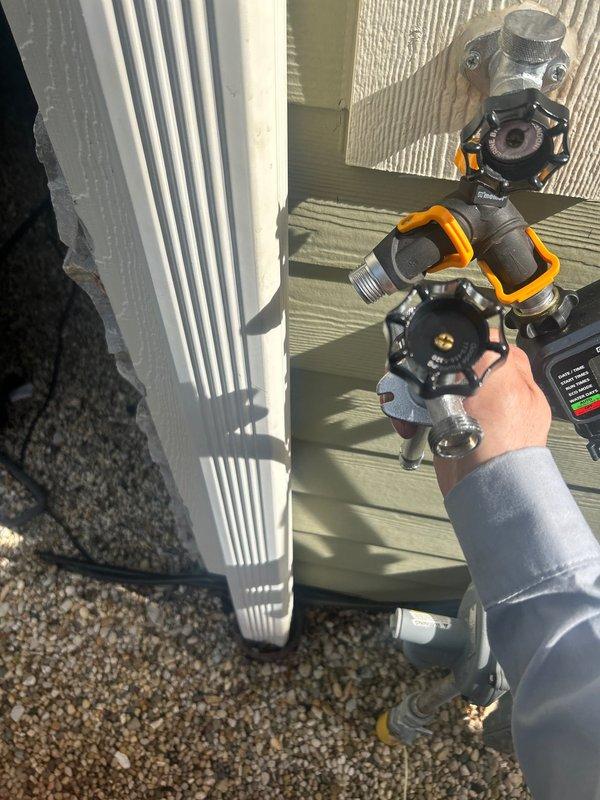 Replaced defective vacuum breaker on exterior hose spigot. Removed old unit and installed new vacuum breaker assembly to prevent backflow contamination of potable water supply. All work completed from exterior of property, ensuring proper sealing and functionality of outdoor water connection.