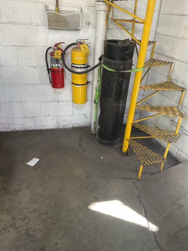 Responded to a non-service call requiring managerial review. Site inspection conducted and photographic documentation completed of basement utility area showing plumbing infrastructure, fire safety equipment, and workspace configuration. No drain or sewer service work performed at this time pending further assessment and approval.
