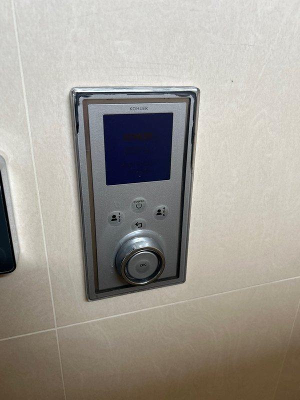 Responded to a leaking overhead shower issue with Kohler digital control system. Diagnosed malfunctioning digital valve assembly causing water seepage. Replaced defective Kohler digital thermostatic valve cartridge with new Newform component to restore proper operation and eliminate leak.