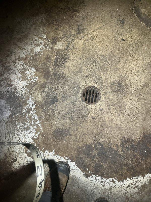Responded to morning appointment for assessment of two broken drain lines leading to catch basins. Upon inspection, identified damaged drainage system with floor drains showing signs of age, deterioration, and potential structural compromise. Documented existing conditions including concrete floor degradation, efflorescence deposits, and drain components requiring replacement. Provided comprehensive residential drain and sewer estimate for repair of compromised drainage infrastructure and restoration of proper water flow to catch basin system.