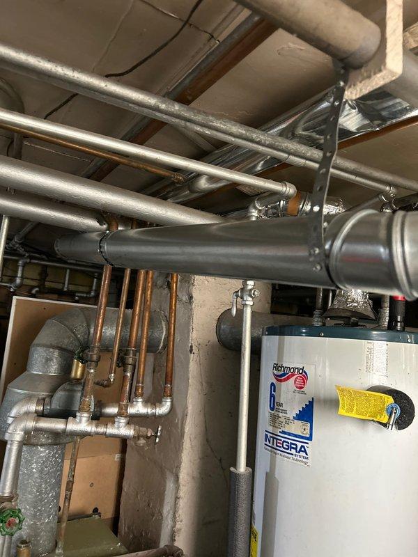 Responded to no hot water condition at residential property. Upon arrival, found recently replaced water heater with code violations related to shutoff valve and venting system. Additionally diagnosed no water flow issue to first floor following water heater replacement. Removed existing non-compliant shutoff valve and installed code-compliant valve with proper clearances and accessibility. Corrected venting configuration to meet current plumbing code requirements, ensuring proper draft and combustion air supply. Restored water service to first floor by identifying and resolving supply line obstruction in distribution piping. Verified all connections for leaks, tested water heater operation, and confirmed adequate hot water delivery throughout dwelling. System now operates safely and in full compliance with applicable plumbing codes.