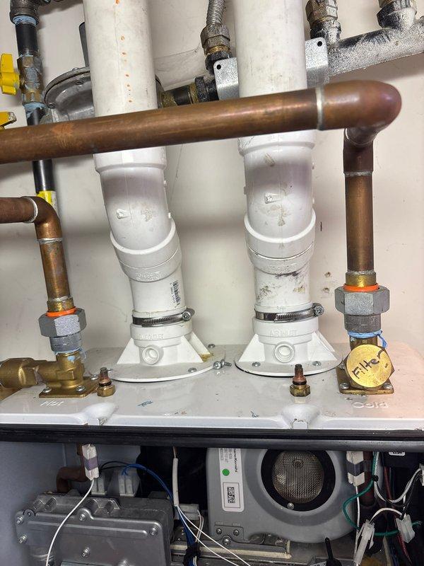 Completed comprehensive plumbing maintenance inspection of residential property with no active issues reported. Performed thorough evaluation of water heater connections, including hot water outlet piping, brass valves, pressure relief components, and PVC discharge lines, confirming all connections secure with proper sealing and no visible leaks. Inspected copper supply lines, compression fittings, and shut-off valves throughout the system, noting age-appropriate patina on copper piping with no signs of corrosion or deterioration. Examined condensate neutralizer assemblies with mounting hardware and drain valves, verifying proper installation and functionality. All plumbing fixtures, connections, and components found to be in good working condition with no immediate maintenance concerns identified.