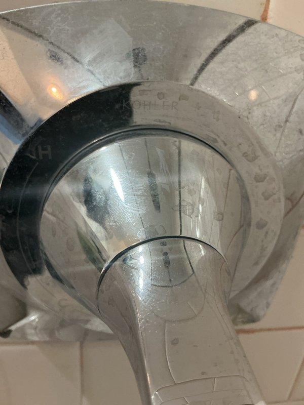 Responded to service call for leaking bathtub faucet. Upon inspection, identified worn valve stem with deteriorated rubber washer causing the leak. Disassembled the shower valve assembly, removed the damaged cartridge and seal components, and installed replacement parts. Addressed corrosion and mineral buildup around the trim plate and mounting area. Tested the repaired fixture to confirm proper operation and verified leak was eliminated.