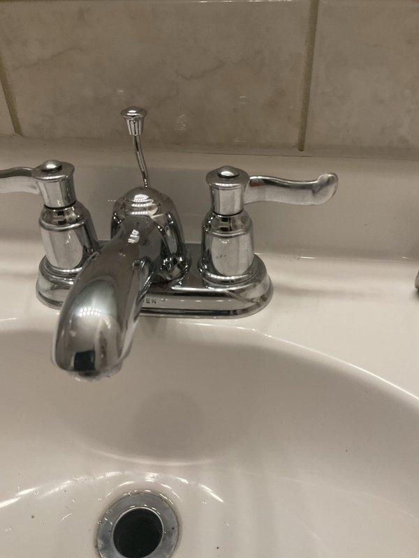 Responded to service call for slow-draining bathroom sink and tub. Upon inspection, accessed under-sink plumbing to assess drainage issue. Cleared obstruction from drain assembly, restoring proper water flow to both fixtures. Verified all connections were secure and tested drainage performance to ensure complete resolution.