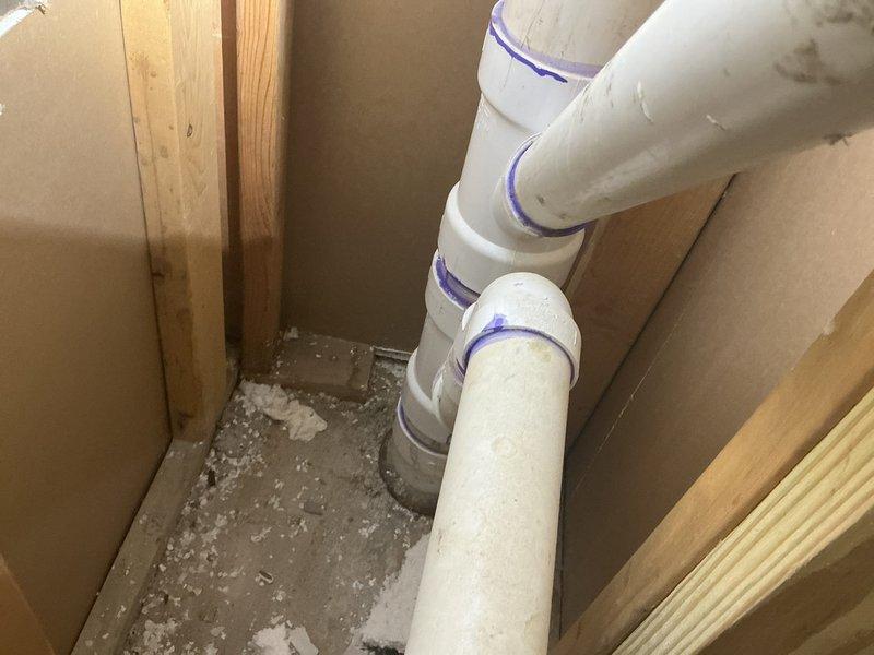 Responded to recurring ejector pump check valve failure. Inspected existing PVC discharge piping system and identified failed check valve causing backflow issues. Replaced defective check valve with new Schedule 40 PVC check valve assembly. Installed rubber couplings to facilitate future maintenance access. Properly primed and cemented all PVC connections per code requirements. Tested system operation to verify proper flow direction and confirm check valve seating correctly to prevent backflow into ejector pit.