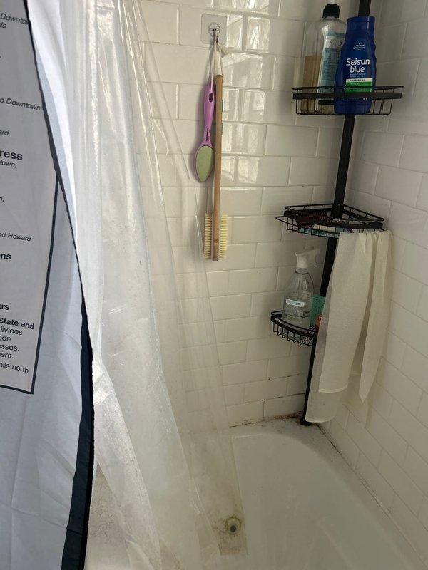 Conducted on-site assessment for tub replacement in residential bathroom with white subway tile shower/tub surround. Evaluated existing bathtub condition, surrounding tile work, plumbing access points, and structural considerations for replacement installation. Documented current bathroom configuration including tile condition, drainage system, and access to plumbing infrastructure through attic space above bathroom. Provided comprehensive estimate for complete tub removal and replacement, including necessary plumbing modifications and finish work requirements.