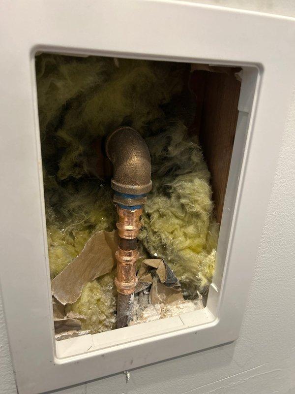 Installed new outdoor spigot assembly with quarter-turn ball valve featuring brass body construction and freeze-resistant design. Completed copper pipe connections, installed interior shut-off valve with access panel, and verified proper insulation around wall penetration to prevent freeze damage.