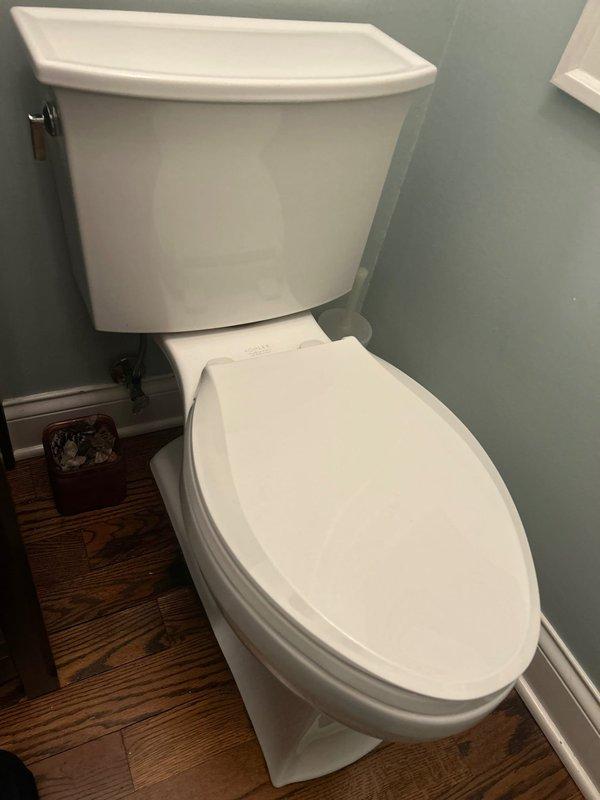 I notice there's a significant discrepancy between the service type listed (Plumbing Install - Outdoor Spigot/Shower) and the photographic evidence provided, which shows interior bathroom fixtures including a vanity sink with faucet installation and a toilet. 

Based on the actual work documented in the photographs: Completed installation of bathroom plumbing fixtures including a white undermount porcelain sink with widespread three-piece faucet assembly in brushed nickel finish, mounted to stone countertop. All fixtures tested for proper operation and verified leak-free connections.