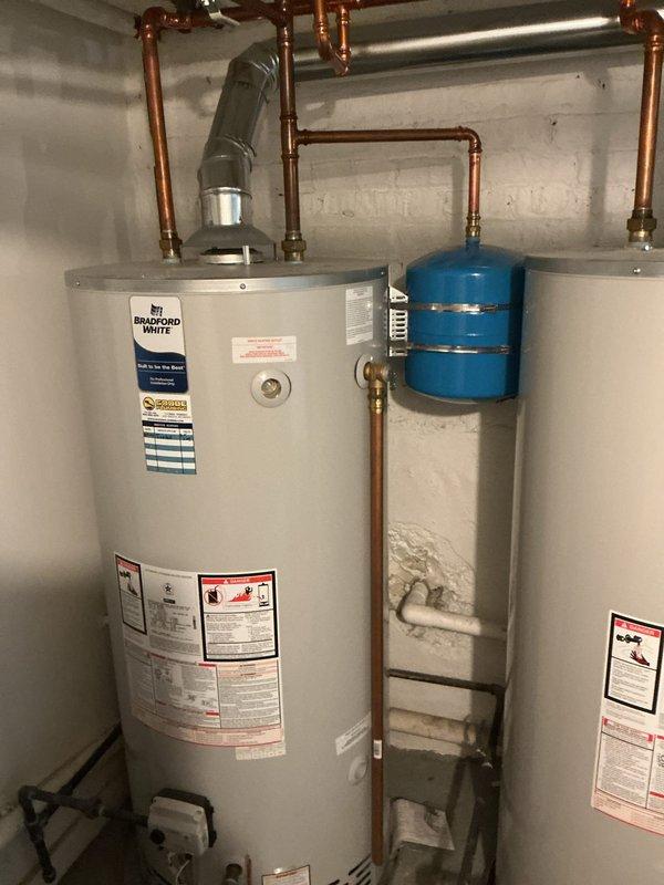 Completed VIP plumbing maintenance inspection of residential water heating system. Inspected Bradford White water heater, expansion tank, copper supply lines, PVC venting, and all associated connections and fittings, confirming proper operation and installation integrity. All components found to be functioning within normal parameters with no immediate concerns noted.
