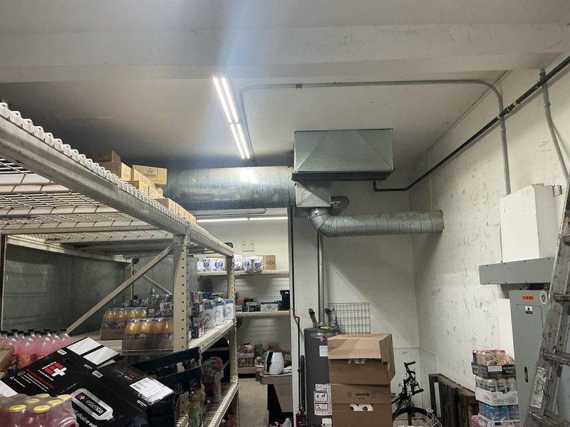 Conducted on-site assessment for interior water service replacement at commercial retail liquor store. The municipality will handle the exterior water main connection, requiring coordination for the interior service line installation from the building entry point to the existing plumbing system. Inspected the retail floor area and basement storage space to determine routing requirements through the commercial structure. Documented existing conditions including exposed ductwork, shelving configurations, and storage areas that will need to be considered during installation. Evaluated access points through white brick walls and concrete ceiling areas where new water service piping will need to be installed. Prepared comprehensive estimate for interior water service work to connect with the city's exterior installation.